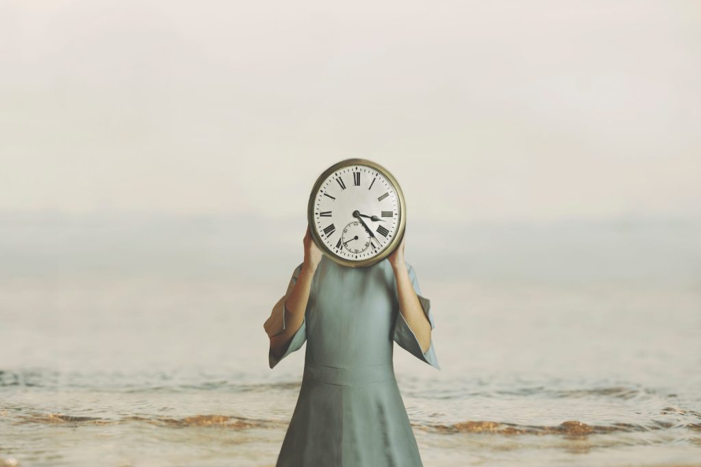 Surreal,Woman,With,Clock,In,Place,Of,Face,Checks,Time